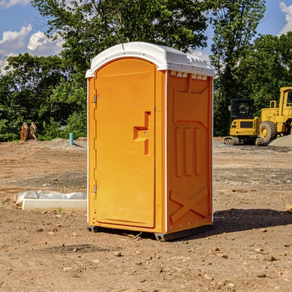 what is the cost difference between standard and deluxe portable toilet rentals in Orange